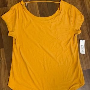 Mustard colored shirt.